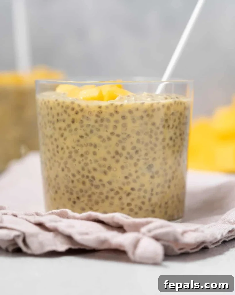 Tropical Mango Chia Bliss 3 side shot of a clear cup filled with chia seed pudding made with mango and coconut milk