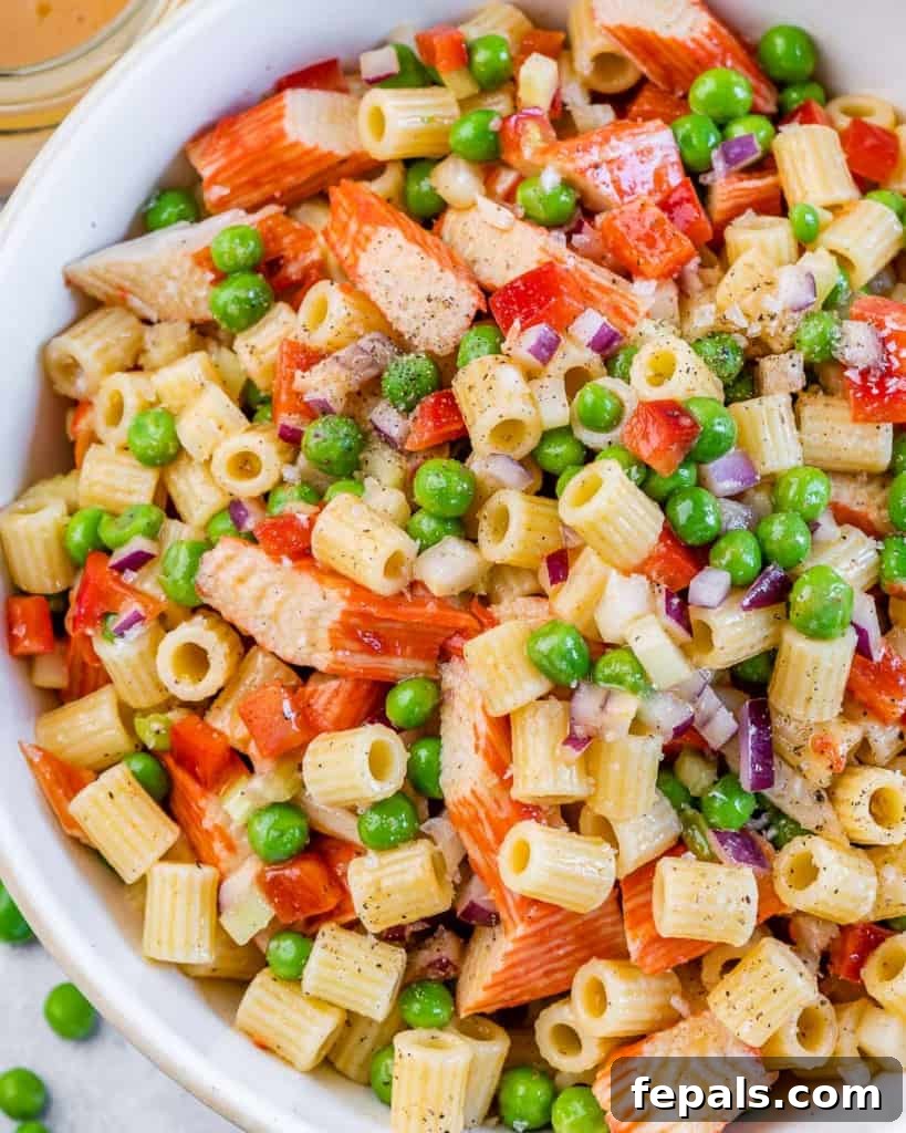 close up and top view of a bowl with pasta salad