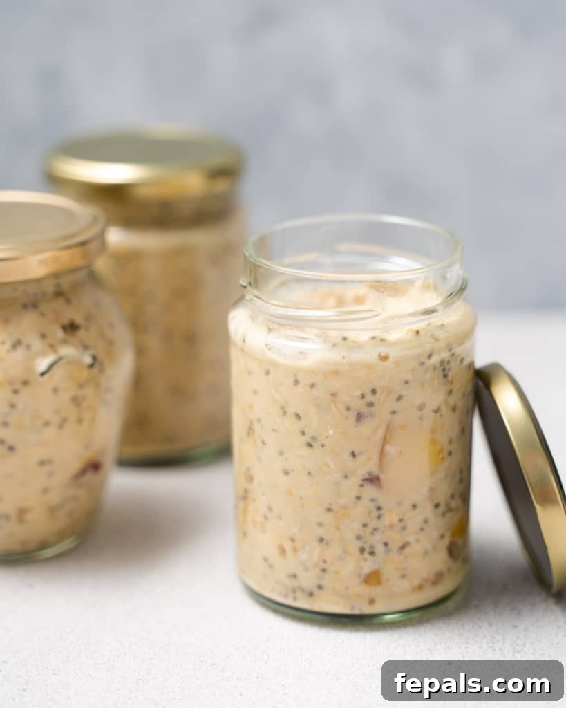 Velvet Peach Dream Oats 11 Adding overnight oats to glass jars with lids.