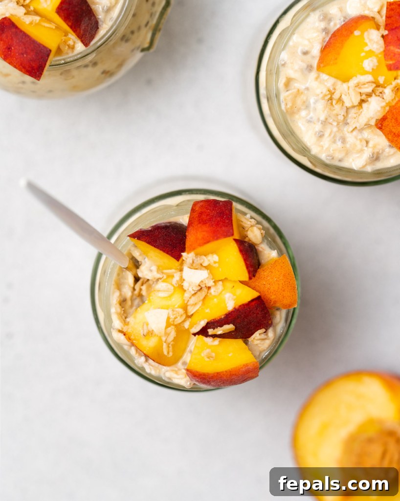 Velvet Peach Dream Oats 16 top view jar of overnight oats topped with chopped peaches