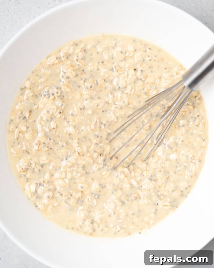 Velvet Peach Dream Oats 9 Whisking together oats with milk, yogurt and chia seeds.