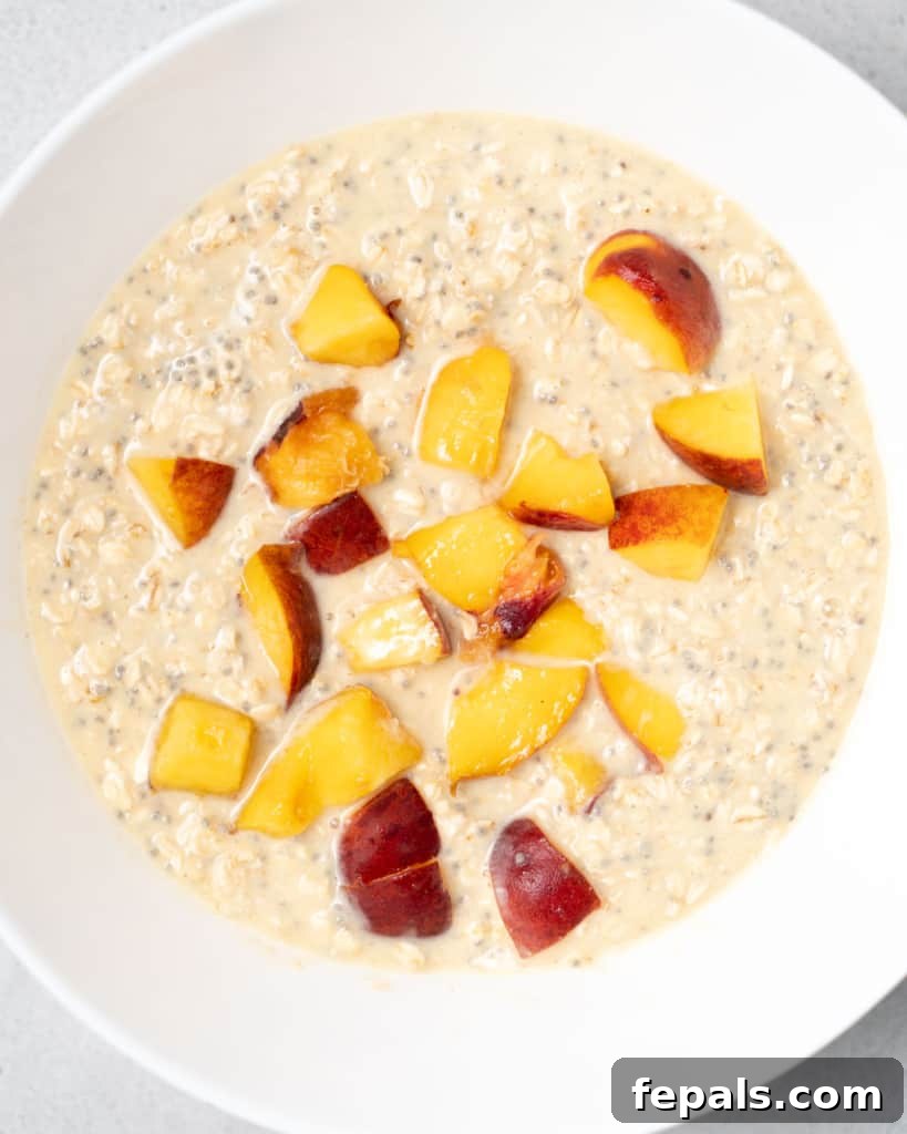 Velvet Peach Dream Oats 10 Adding chopped peaches to overnight oats.