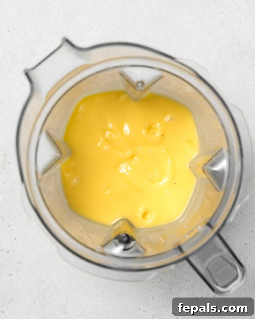 Tropical Mango Delight 7 Mango smoothie in a blender.