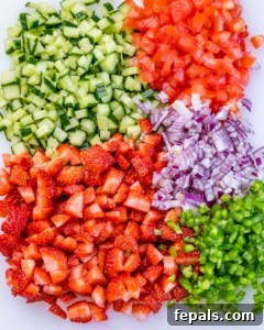 Chopped strawberries, cucumbers, red onion and tomatoes.