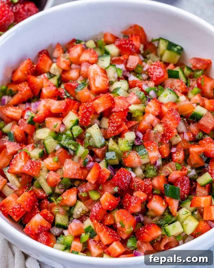 Strawberry salsa served in a white bowl.