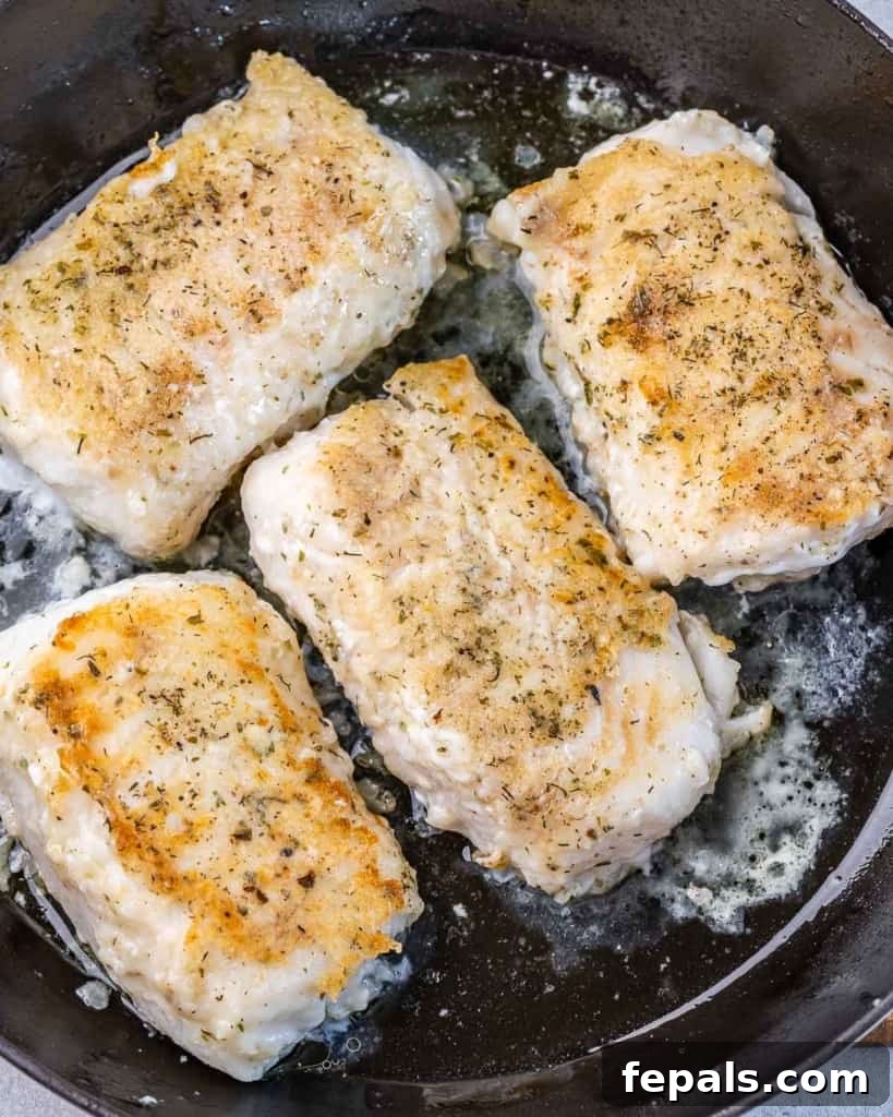 Bright Lemon Garlic Cod Bake 6 seared 4 Cod fillets on a skillet