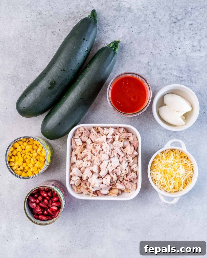 ingredients laid out to make chicken enchilada zucchini roll ups 