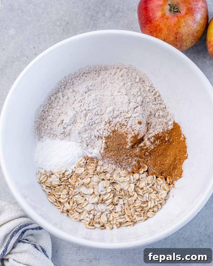 Warm Apple Cinnamon Oat Cookies 6 Combining oats, flour and spices in a large bowl.