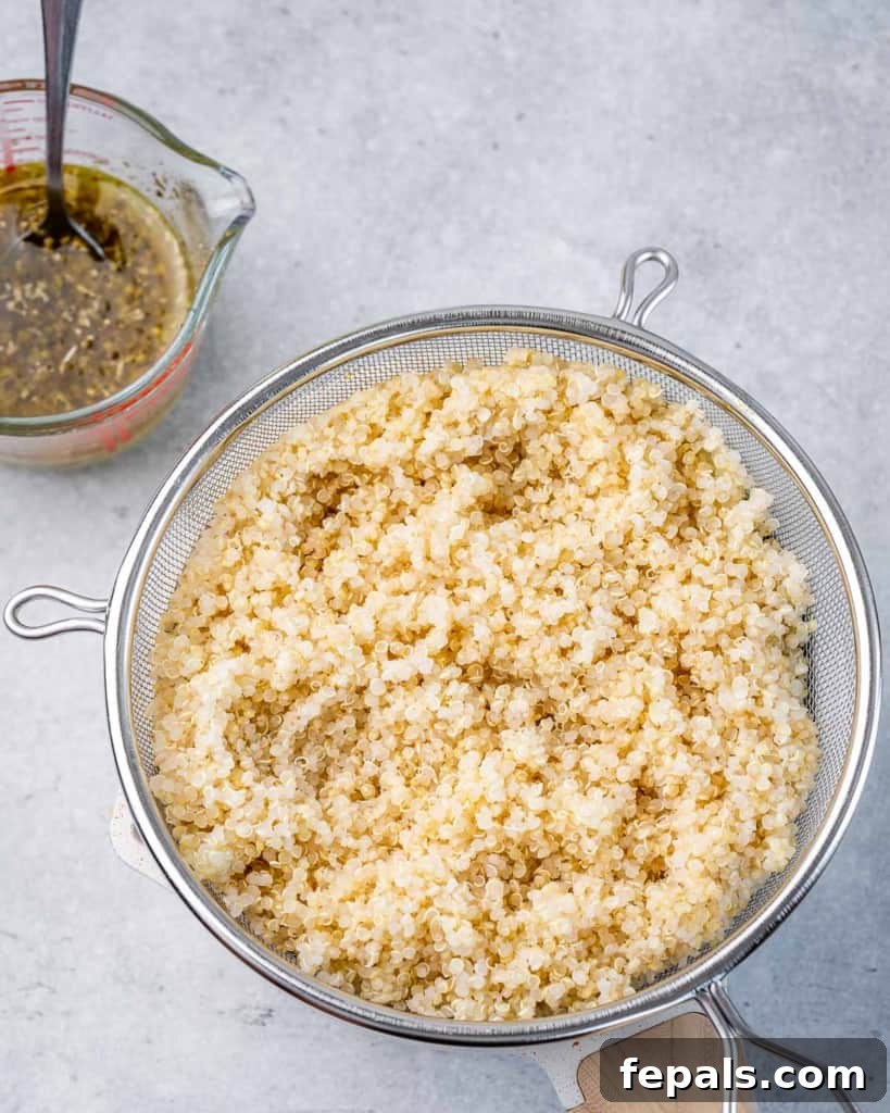 cooked quinoa in a colander