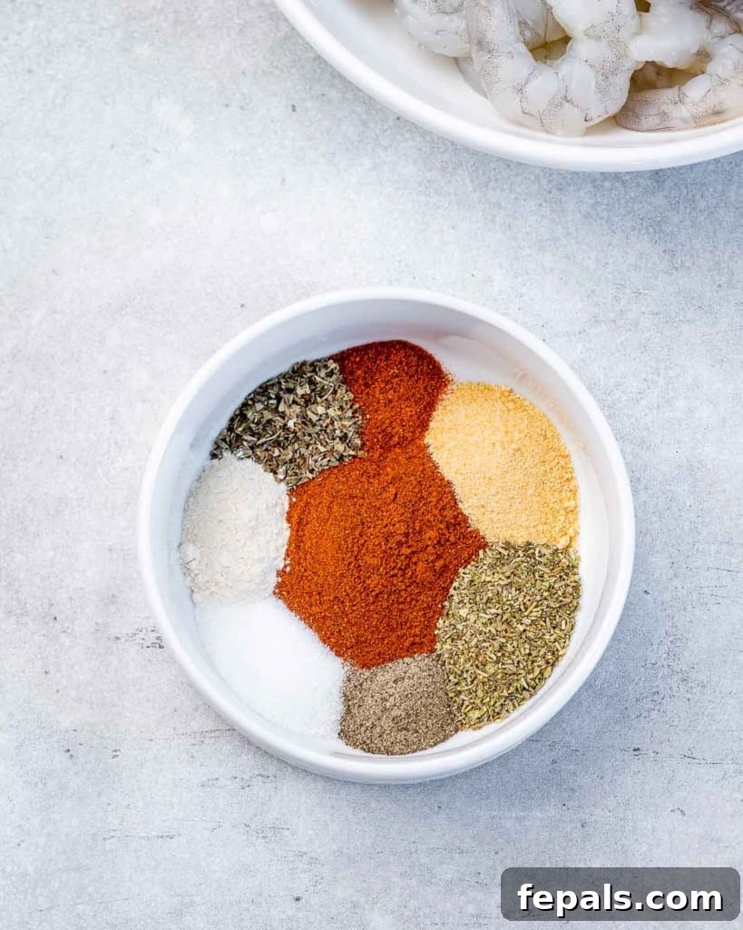 A variety of spices in a white bowl.
