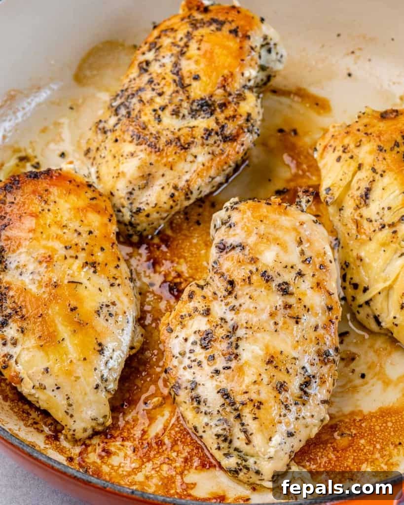 Tuscan Chicken Pomodoro 5 Cooking chicken breasts in a skillet.