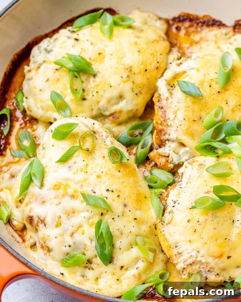 Chicken breast covered in cheese baked in a pan.