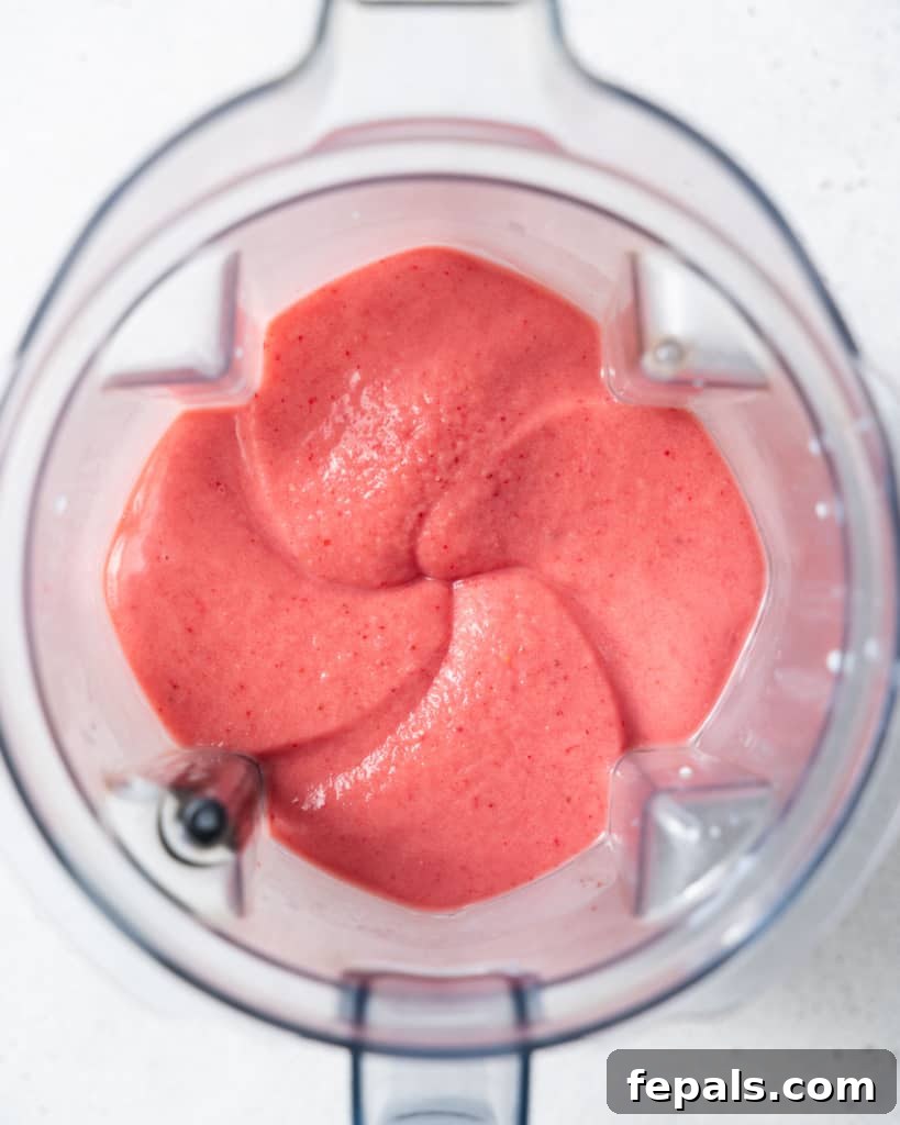 Blended smoothie in a blender, showing the creamy texture.