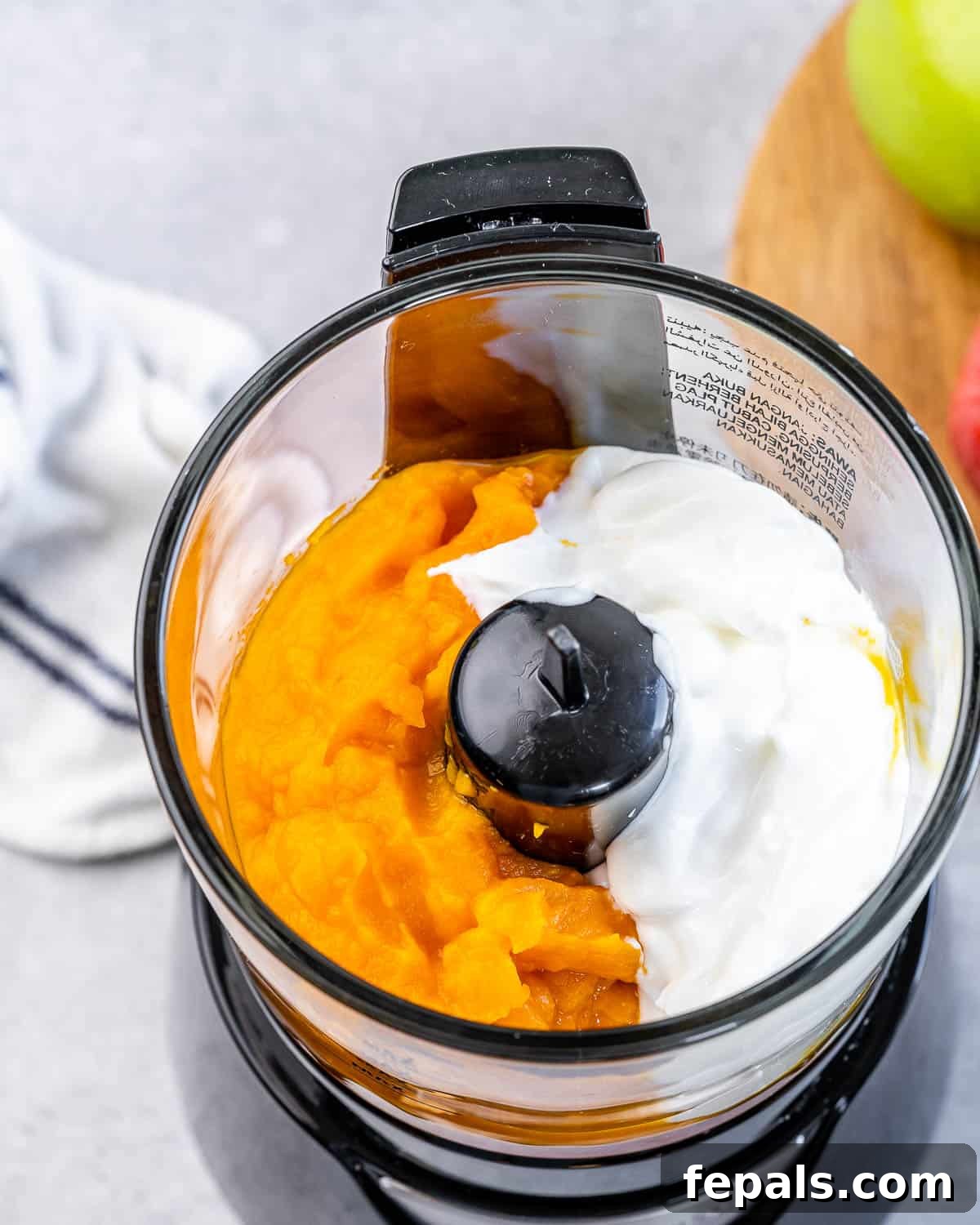 Pumpkin, greek yogurt and vanilla in a food processor.
