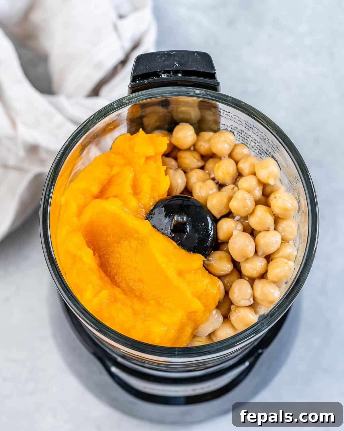 Spiced Pumpkin Hummus 5 Chickpeas and pumpkin puree in a food processor.