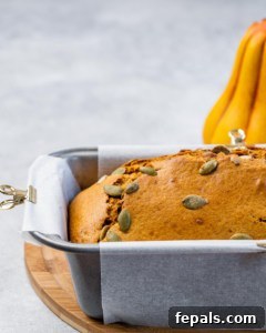 Pumpkin bread baked in a loaf pan.