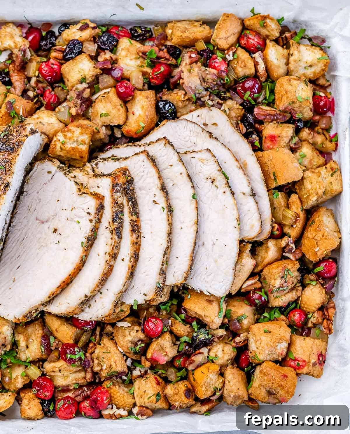 Golden Herb Roasted Sheet Pan Turkey Breast 10 Perfectly sliced roasted turkey breast elegantly plated with a generous portion of stuffing.