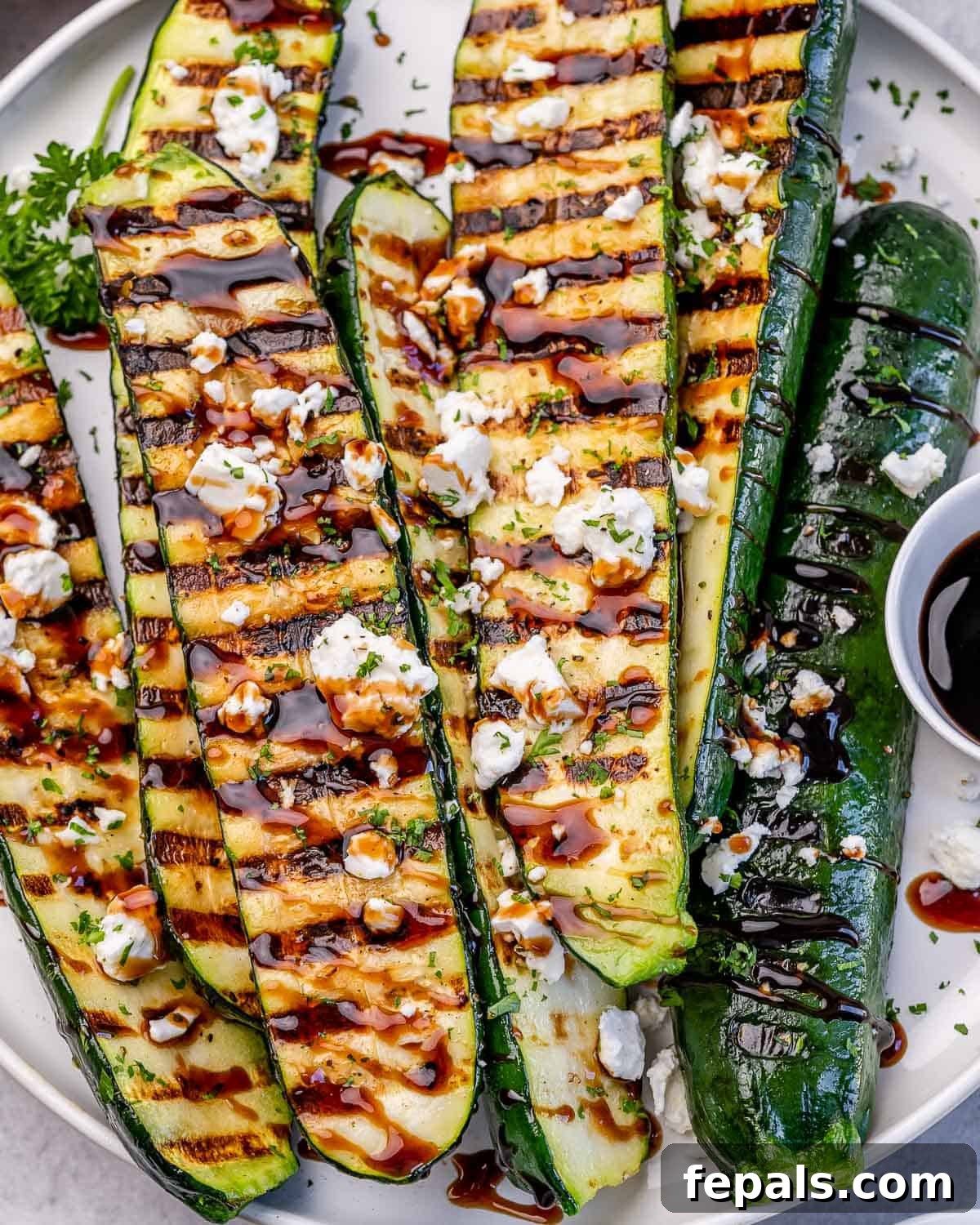 Grilled zucchini topped with a honey balsamic glaze and goat cheese.