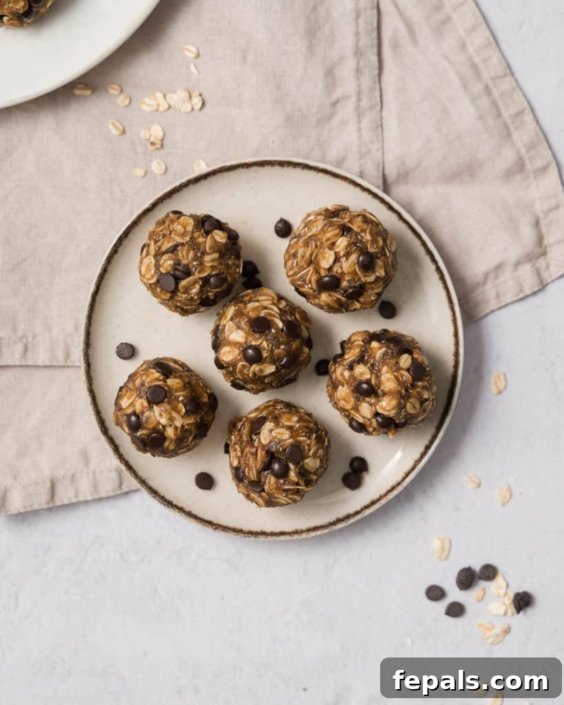 Spiced Pumpkin Power Morsels 17 Six perfectly formed pumpkin energy bites arranged on a charming round plate, highlighting their appetizing appeal.