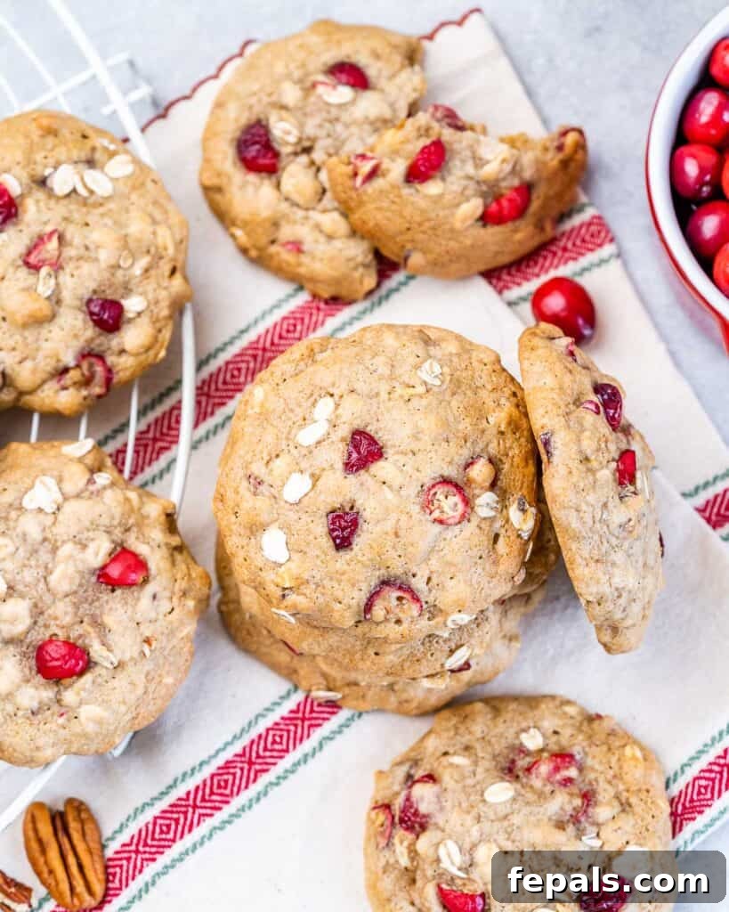 Cranberry Oat Delights 8 top view of cranberry cookies laid out over a festive red and white towel