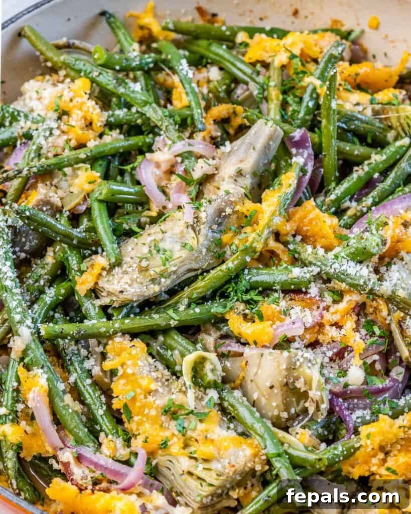 Mediterranean Artichoke Green Bean Bake 3 close up image of green beans and artichoke casserole in a skillet