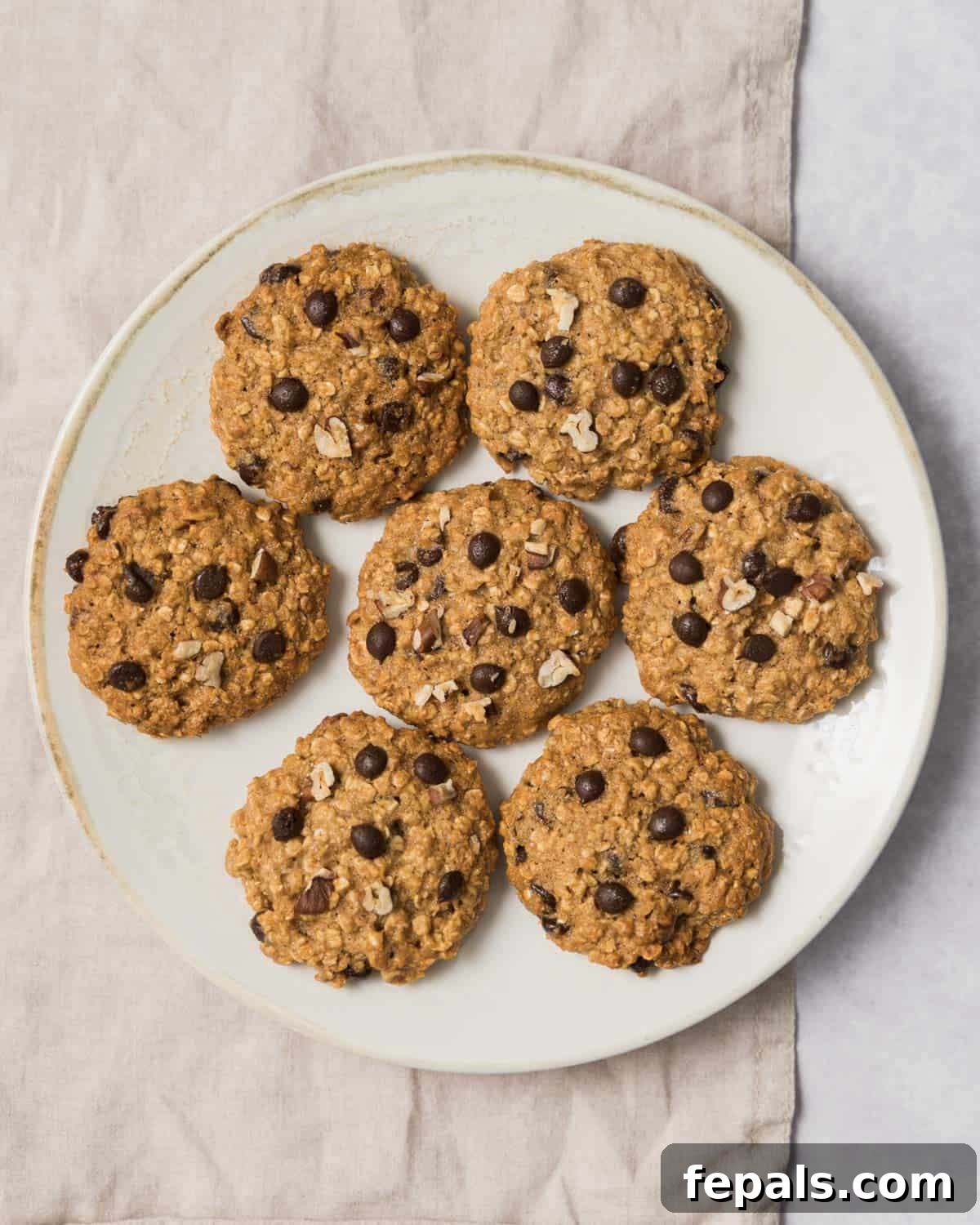 Wholesome Western Wonders 2 Top view of 7 baked Healthy Cowboy Cookies on a round plate.