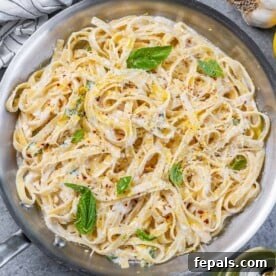 Bright Lemon Ricotta Pasta 12 top view pan with lemon and ricotta creamy pasta with parsley garnishes