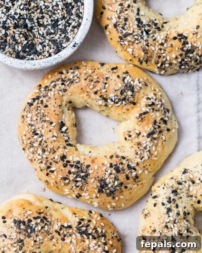 Protein-Packed Greek Bagels 2 top view of baked bagels on a flat surface, showcasing their golden crust