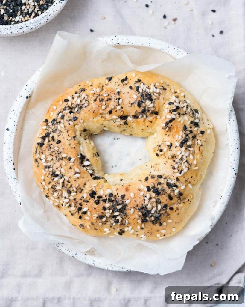 Protein-Packed Greek Bagels 9 top view of a single baked bagel in a bowl, showcasing its delicious texture