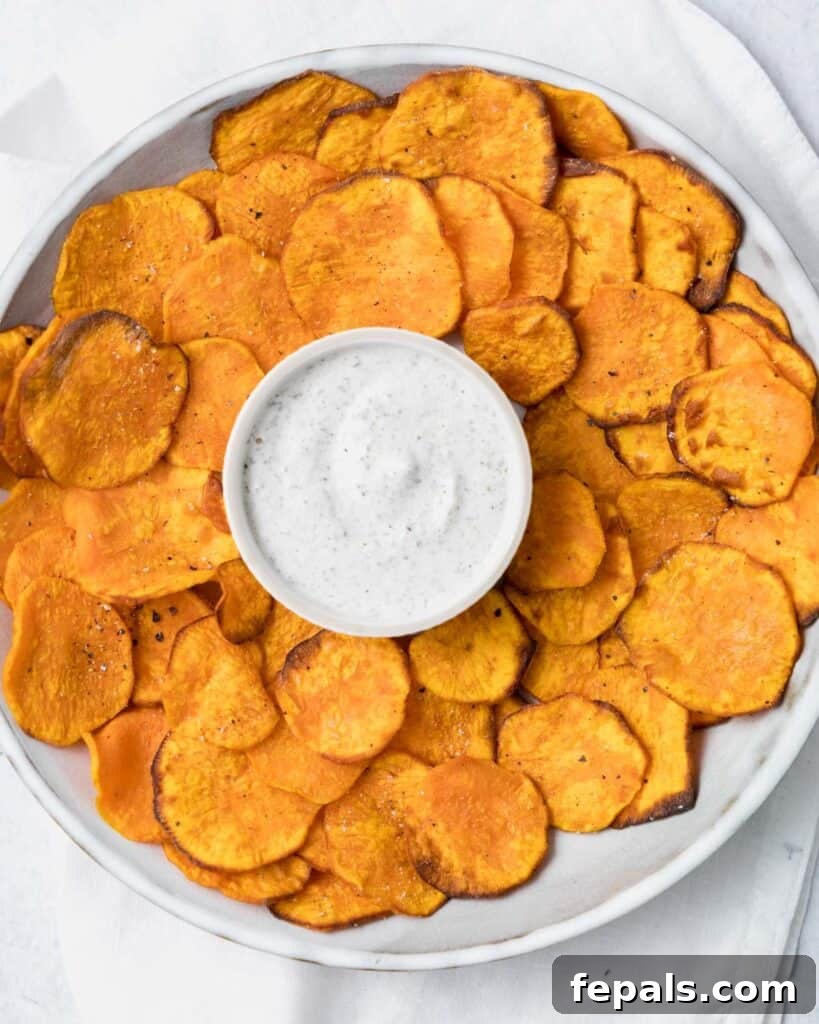 Crispy Air-Fried Sweet Potato Crisps 14 top view of sweet potato chips in a bowl with ranch dip on middle of bowl