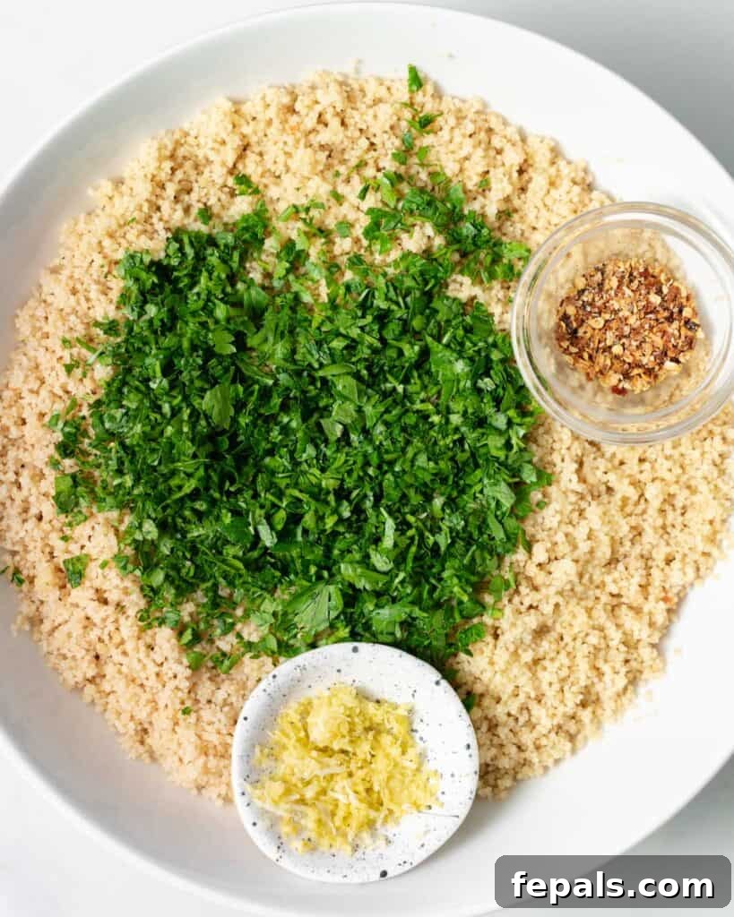 Cooked couscous, chopped fresh parsley, garlic and lemon zest in small bowls.