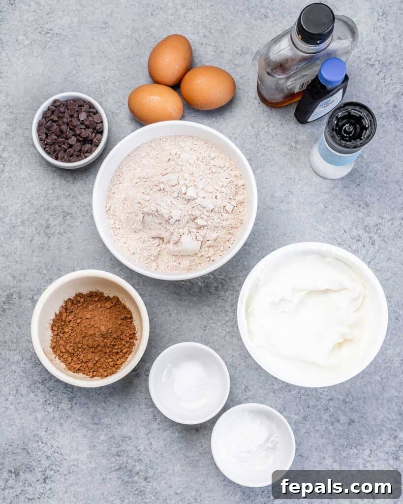 Ingredients laid out on a flat surface, ready to make delicious chocolate waffles.