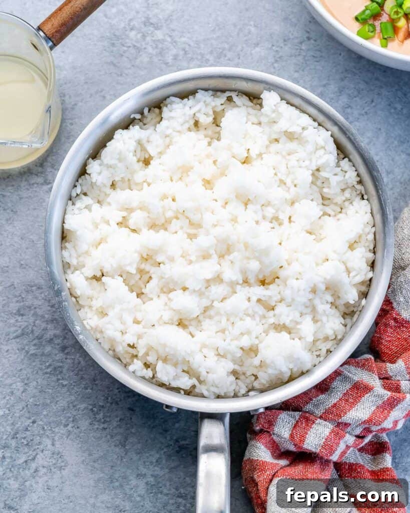 Ultimate Salmon Sushi Bake 5 Rice cooked in a saucepan.