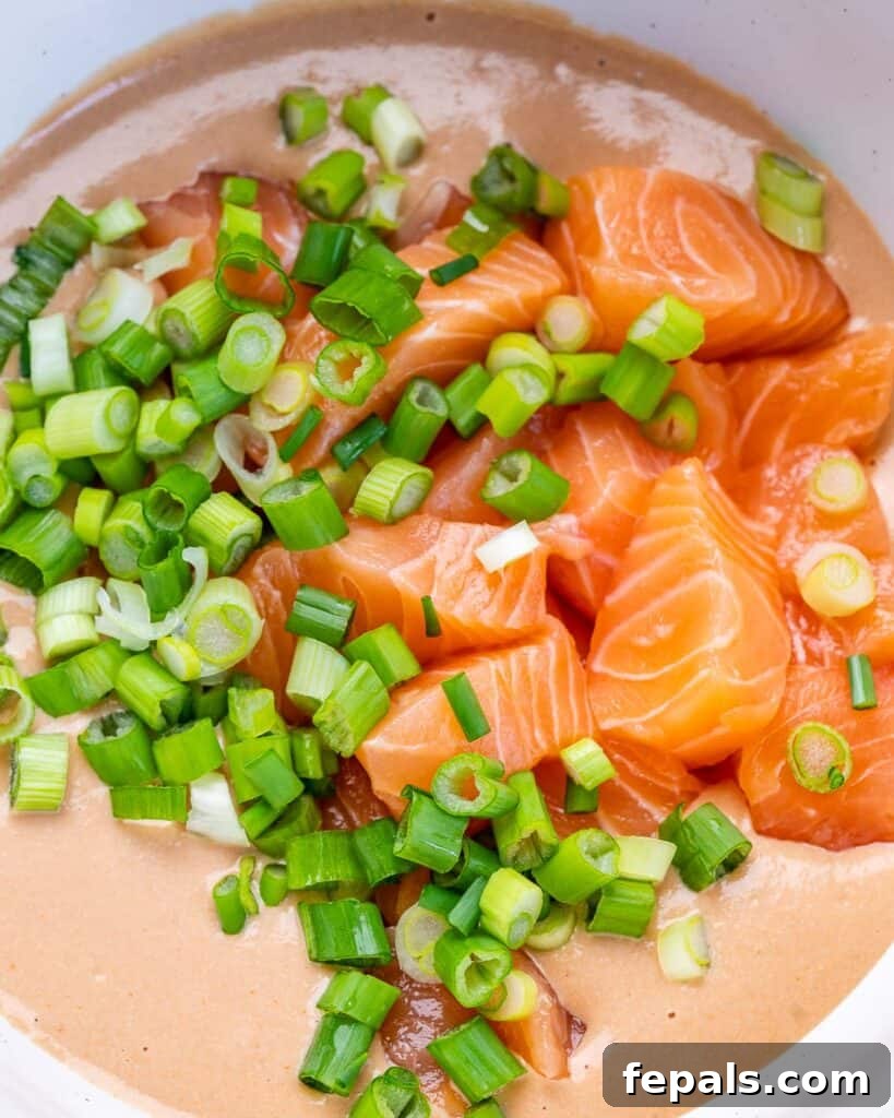 Ultimate Salmon Sushi Bake 6 Chopped salmon and green onions mixed into a cream cheese mixture.