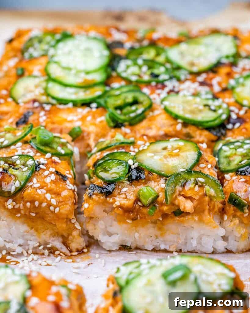 Ultimate Salmon Sushi Bake 10 side shot of salmon sushi bake topped with sliced cucumber