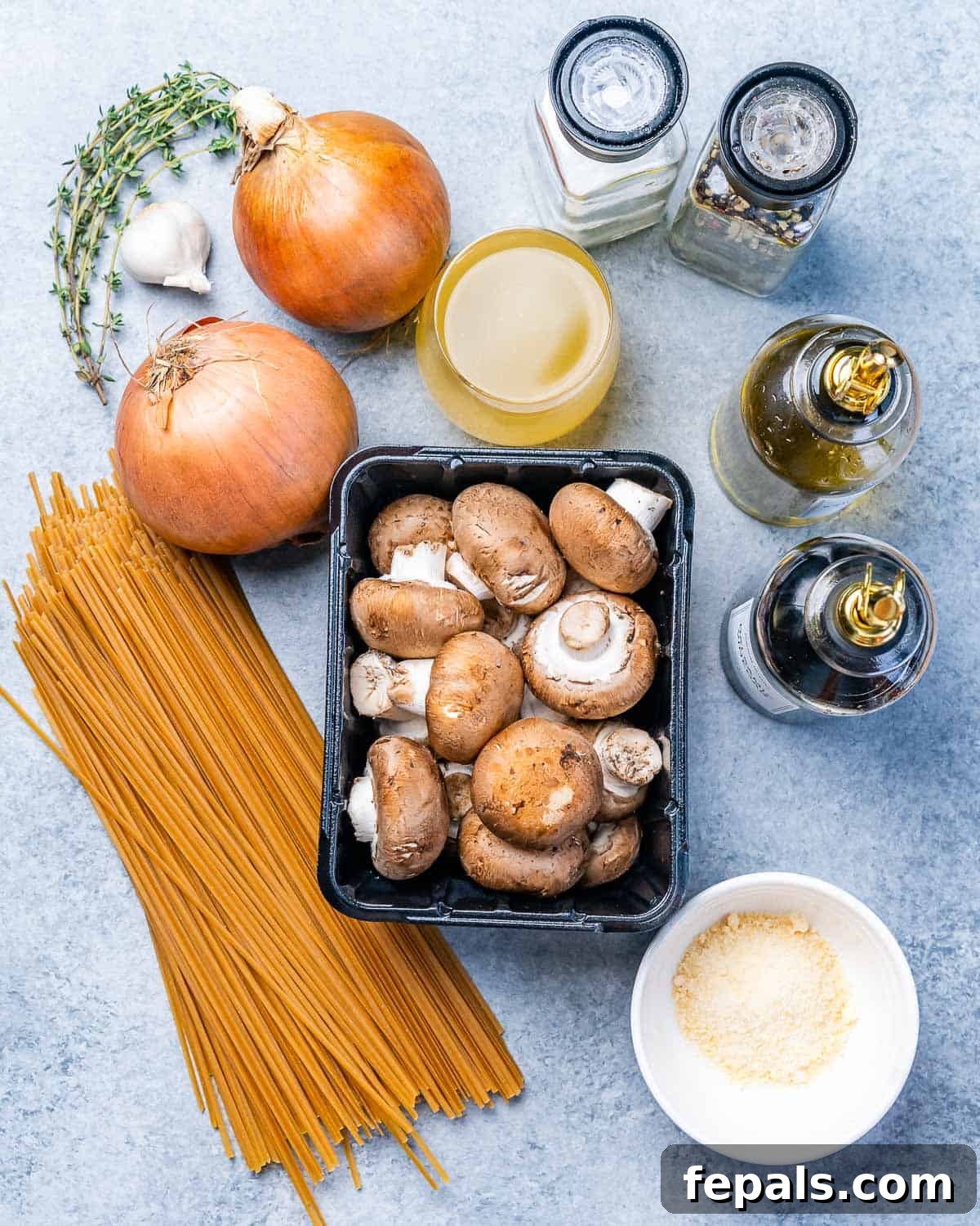 Caramelized Onion and Gruyere Pasta 4 Raw ingredients for French onion pasta: uncooked pasta, mushrooms, onions, parmesan cheese, stock, and thyme.