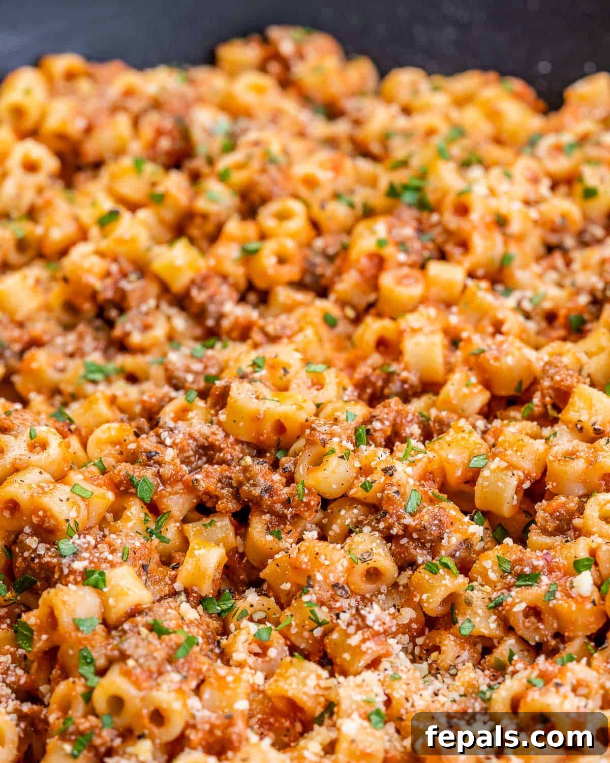 Creamy Cottage Cheese Pasta 3 Closeup view of creamy cottage cheese pasta with crumbled sausage and fresh parsley.