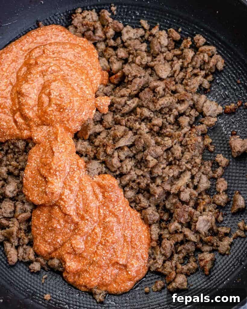 Creamy Cottage Cheese Pasta 7 Creamy marinara poured over ground turkey in a pan.