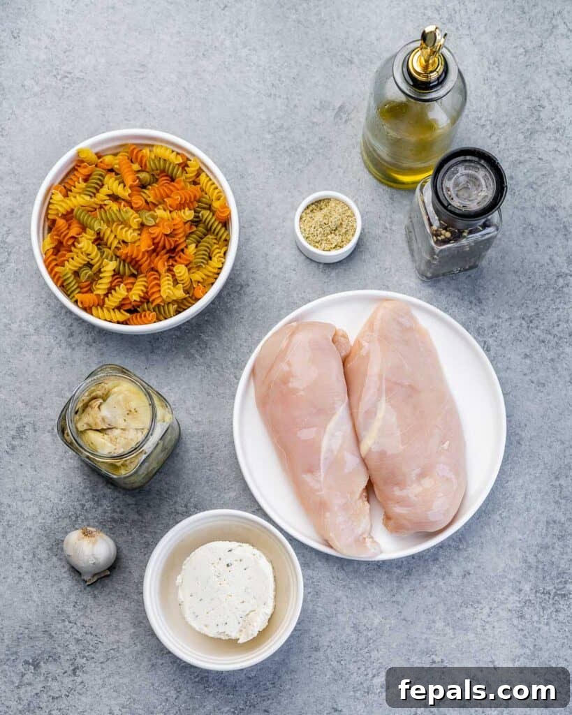 Creamy Chicken Artichoke Delight 4 ingredients laid out to make artichoke chicken pasta