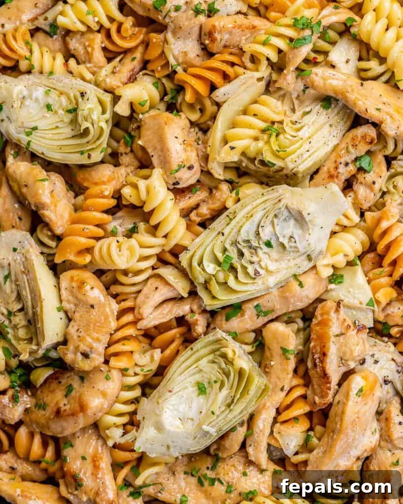 Creamy Chicken Artichoke Delight 8 close up image of pasta with artichoke and chiken