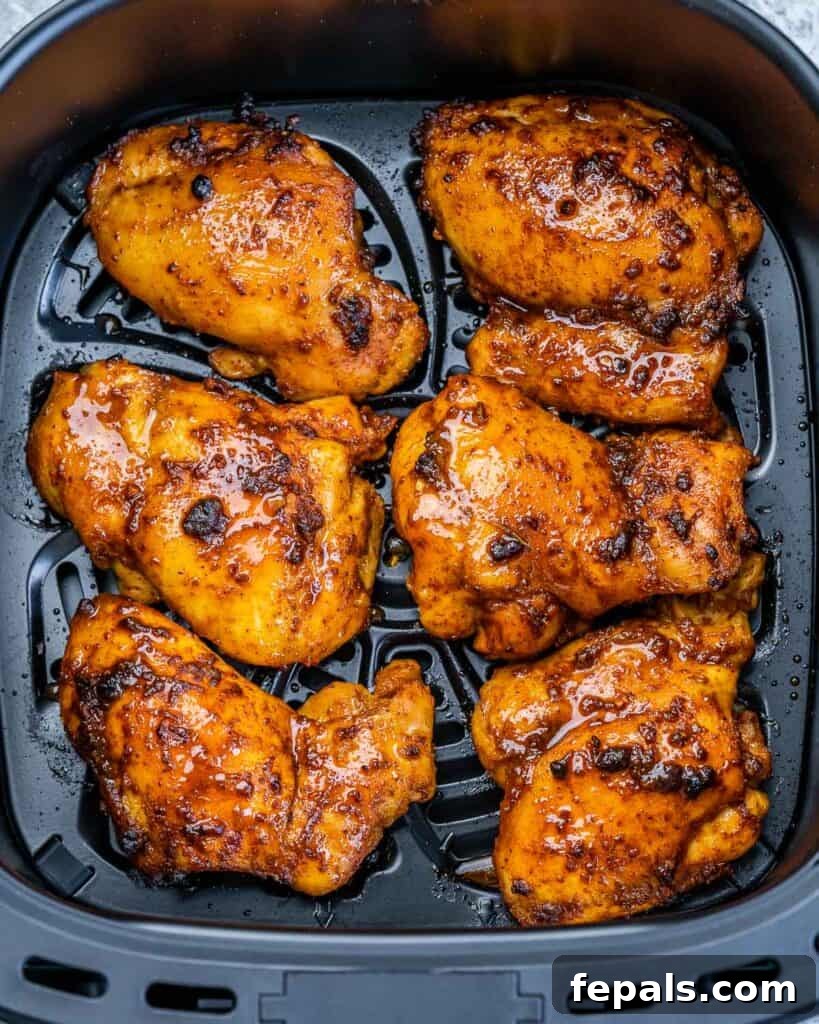 Crispy Air Fryer Boneless Chicken Thighs 8 Air fryer boneless chicken thighs cooking.