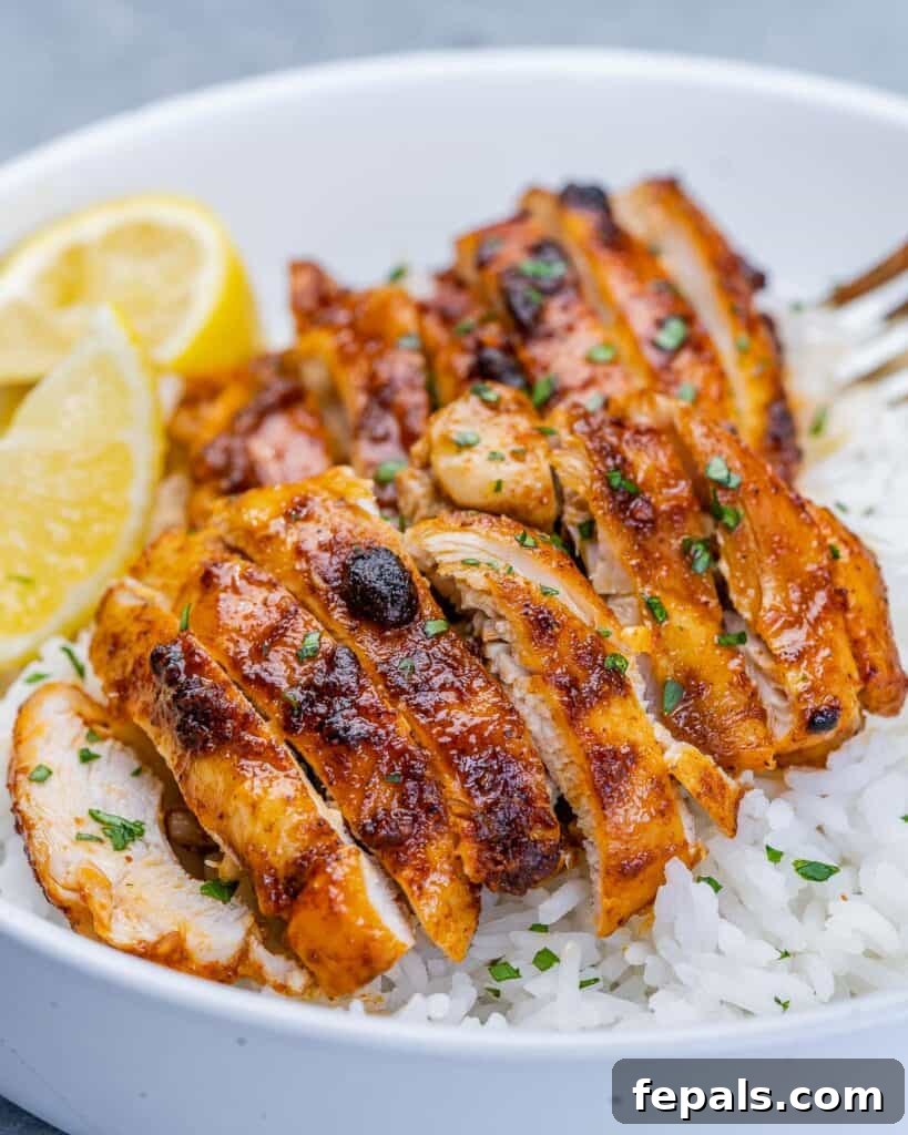 Crispy Air Fryer Boneless Chicken Thighs 9 Air fryer boneless chicken thighs sliced and served over rice.