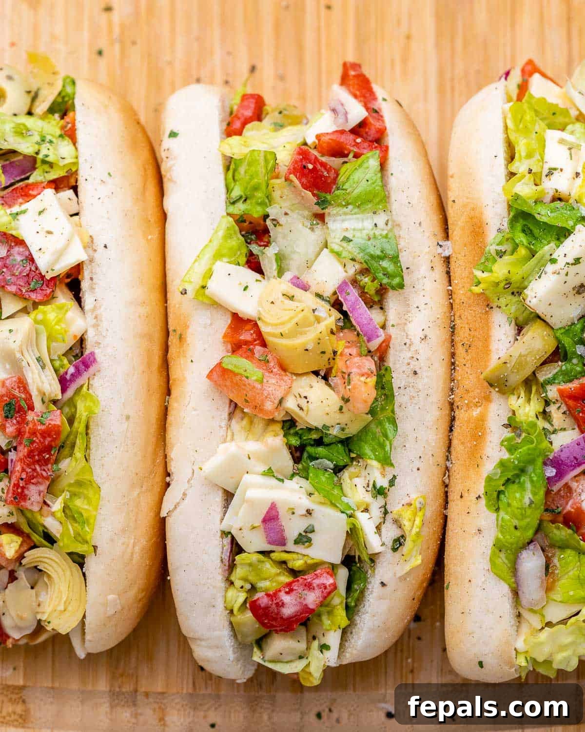 Ultimate Chopped Italian 8 Chopped Italian salad served on a hot dog bun.