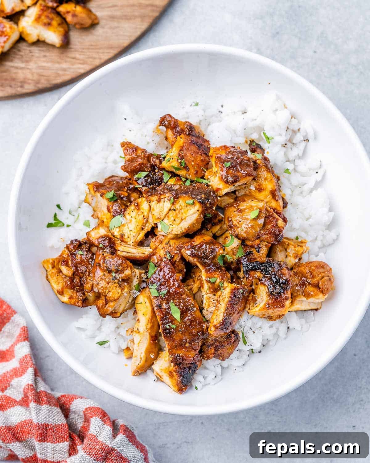 Smoky Chipotle Al Pastor Chicken 11 A simple yet satisfying round bowl filled with white rice, generously topped with tender, chopped homemade Chicken Al Pastor.