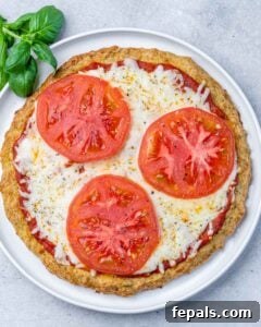 Pizza topped with cheese and tomatoes.