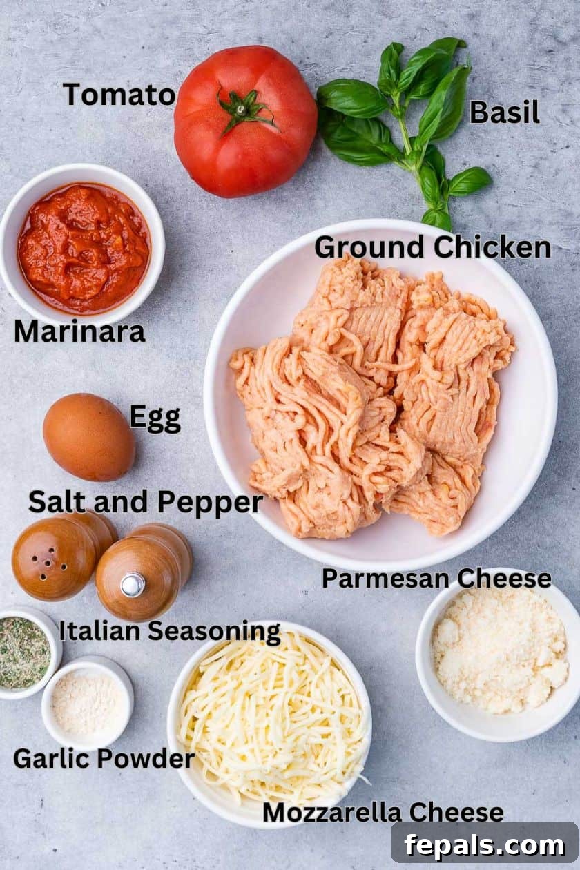 All the fresh and dry ingredients laid out individually and clearly labelled for making chicken pizza crust, including ground chicken, parmesan, egg, and seasonings.