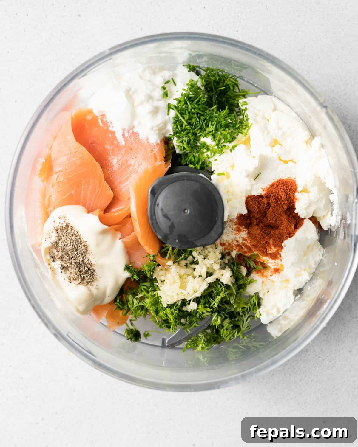 Salmon, cream cheese, sour cream, mayo and herbs in a food processor.