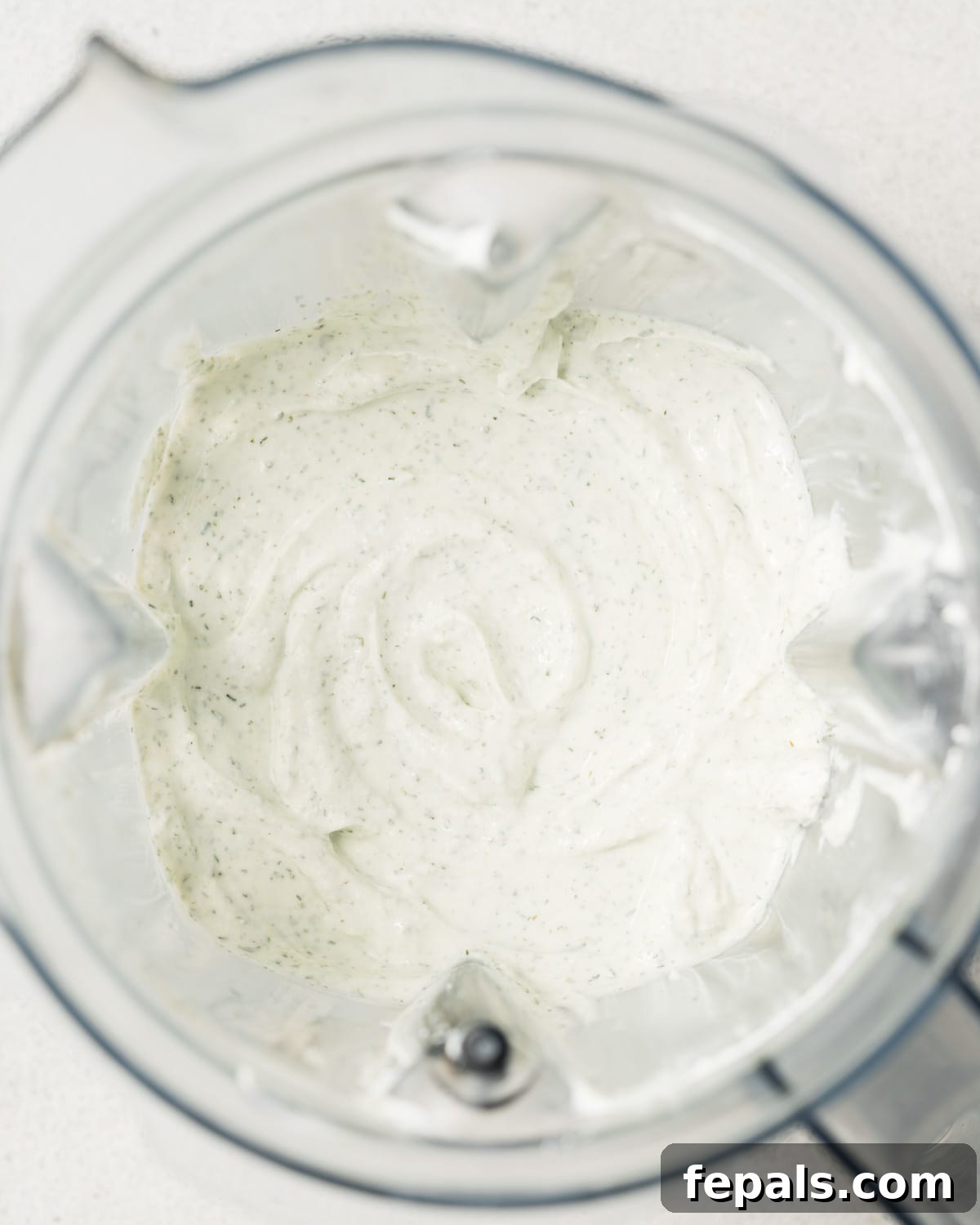 Protein-Packed Ranch Dip 6 Blended cottage cheese with seasonings in a blender.
