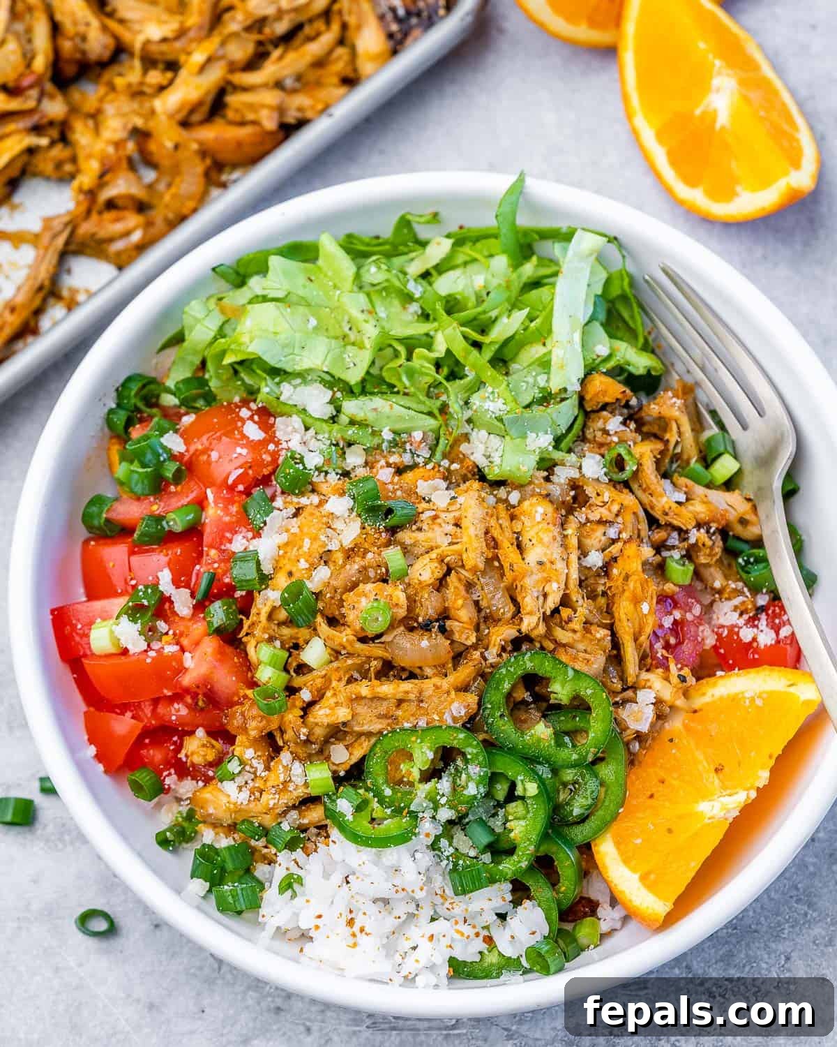 Crispy Pulled Chicken Carnitas 8 A beautifully presented bowl filled with freshly cooked and shredded chicken carnitas, ready to be garnished and enjoyed.