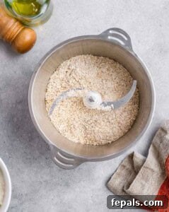 Oats, ground flax seed, salt, and baking powder blended in a food processor to a fine texture.